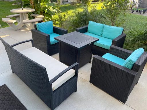 Outdoor area w/plenty of comfortable seating and a grill area